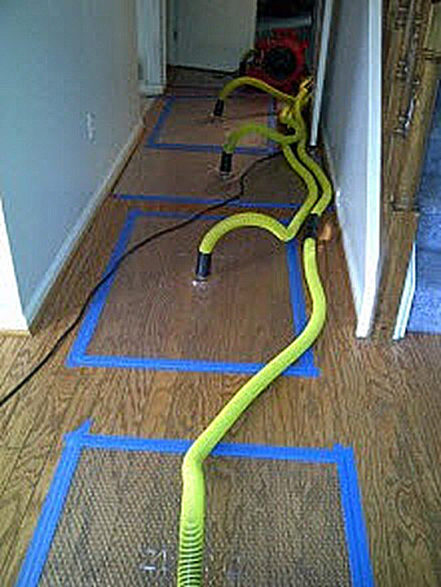water damage to hardwood floors saved with our mat drying system
