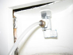 burst ice maker supply line causes basement water damage
