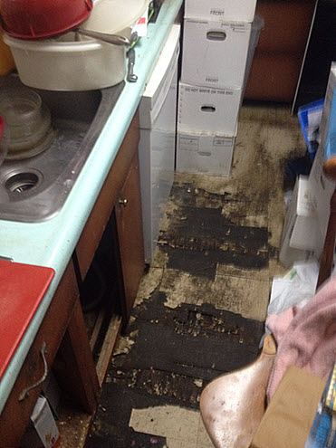 In a Cherry Hill, NJ apartment, holes in floor going to the apartment down below from tenants with hoarding disorder